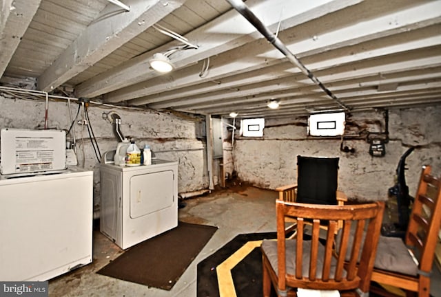 basement with washer and clothes dryer