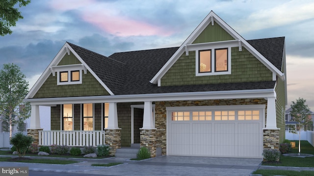 craftsman inspired home with a porch and a garage