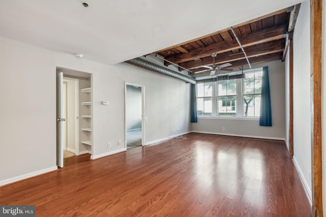 empty room with beam ceiling, ceiling fan, wooden ceiling, and wood-type flooring