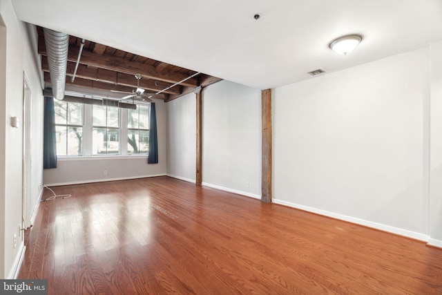 unfurnished room with hardwood / wood-style floors, ceiling fan, and wood ceiling