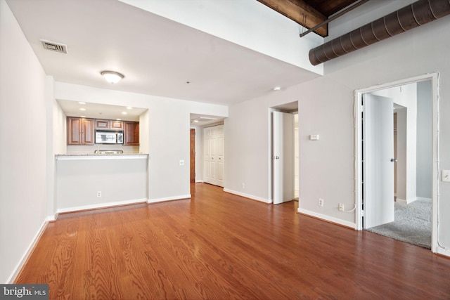 unfurnished living room with hardwood / wood-style flooring