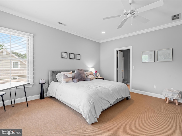 carpeted bedroom with ceiling fan and ornamental molding