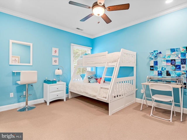 bedroom featuring carpet flooring, ceiling fan, and crown molding