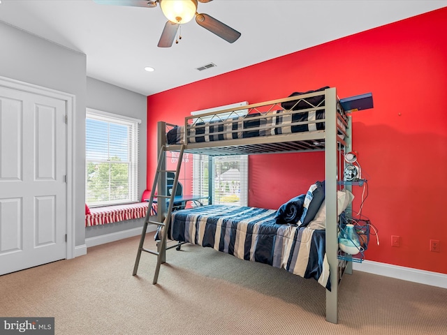 bedroom with ceiling fan and carpet floors