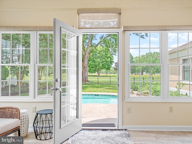 doorway featuring light hardwood / wood-style flooring and plenty of natural light