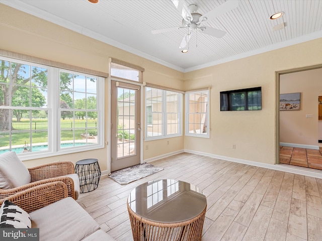 sunroom with ceiling fan and a healthy amount of sunlight