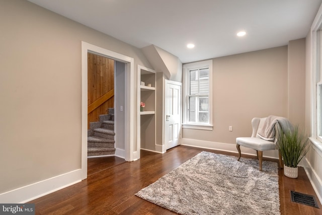 sitting room featuring dark hardwood / wood-style floors