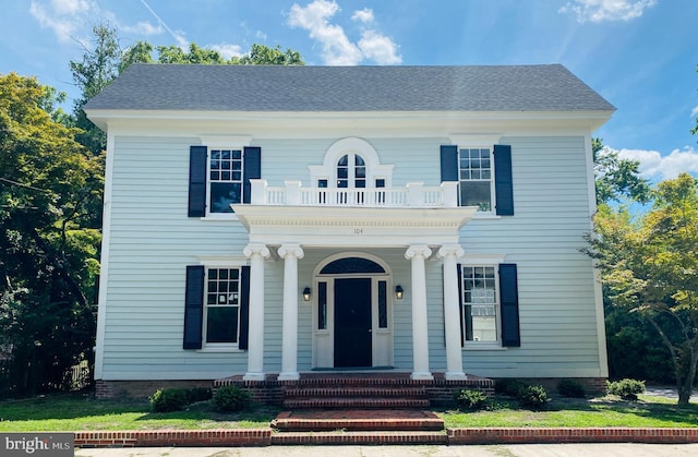 view of front of house with a balcony