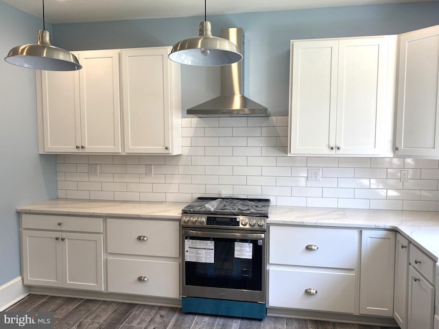 kitchen featuring white cabinets, dark wood-type flooring, stainless steel stove, and wall chimney exhaust hood