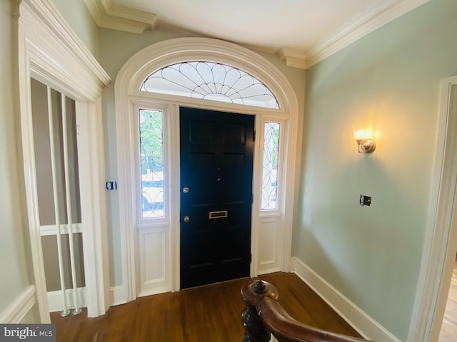 entryway featuring ornamental molding, plenty of natural light, and hardwood / wood-style floors