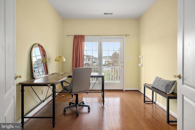 office space with hardwood / wood-style floors