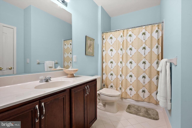 full bathroom with tile patterned flooring, vanity, shower / bathtub combination with curtain, and toilet