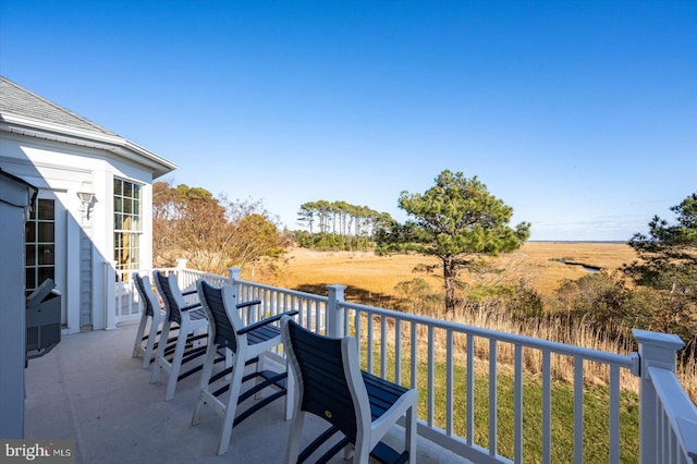 balcony with a patio and a rural view