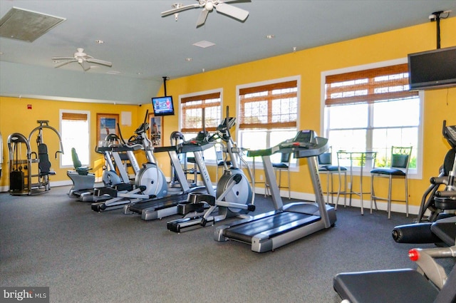 workout area with plenty of natural light and ceiling fan