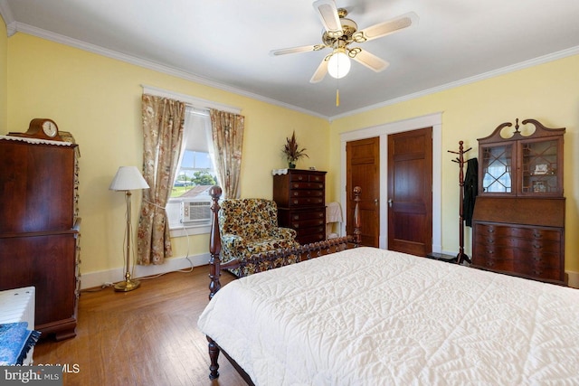 bedroom featuring ceiling fan, wood-type flooring, ornamental molding, and cooling unit