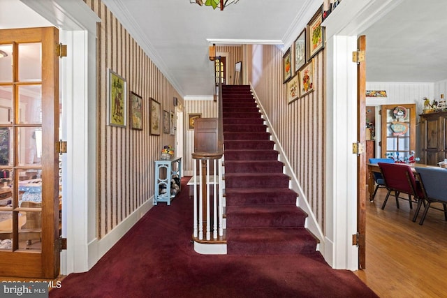 stairway featuring ornamental molding