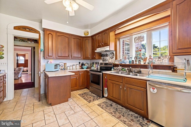 kitchen featuring ceiling fan, appliances with stainless steel finishes, and sink