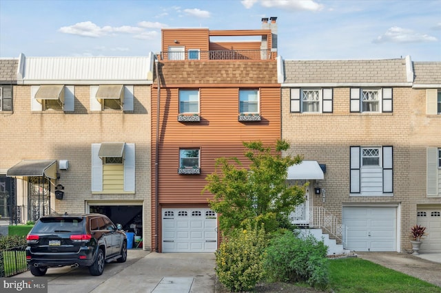 multi unit property featuring a garage