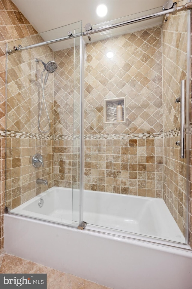 bathroom with shower / bath combination with glass door