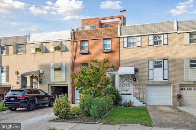 multi unit property featuring a garage