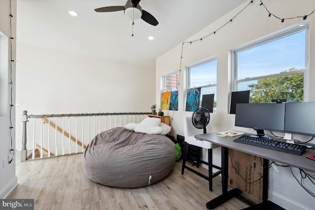 office area with ceiling fan and light hardwood / wood-style floors