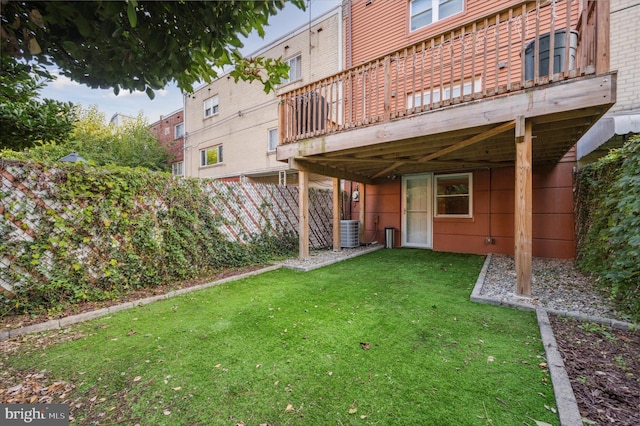 view of yard featuring a deck and cooling unit