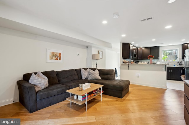 living room featuring light wood-type flooring