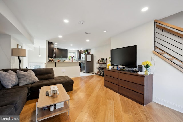 living room with light hardwood / wood-style floors