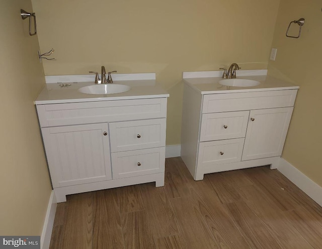 bathroom featuring vanity and wood-type flooring