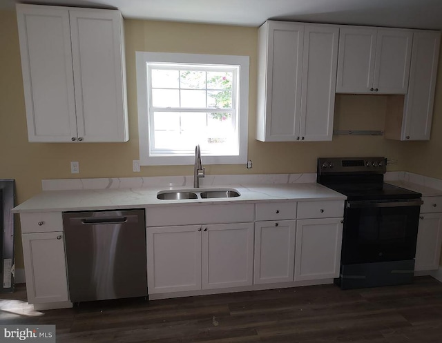 kitchen featuring stainless steel dishwasher, dark wood-type flooring, sink, and black / electric stove