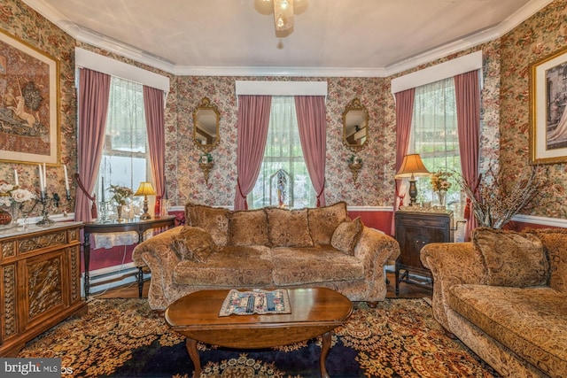 living room with plenty of natural light, crown molding, and ceiling fan