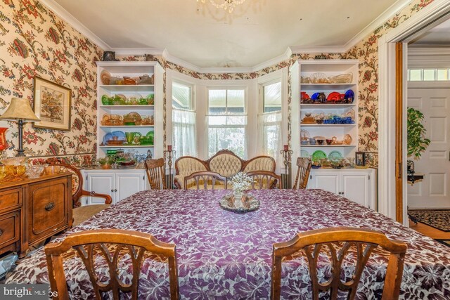 dining area featuring ornamental molding