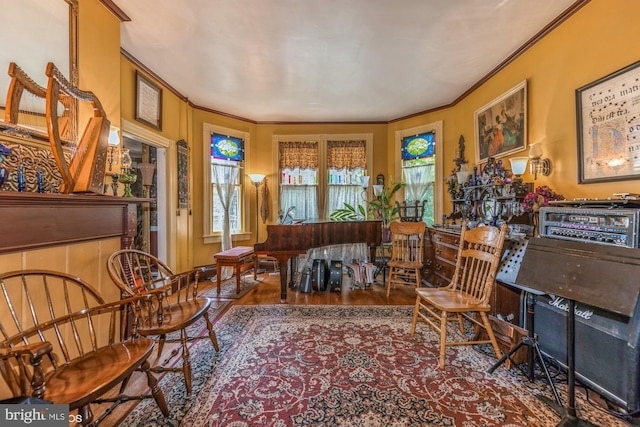 sitting room featuring crown molding and wood-type flooring