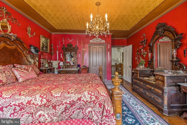 bedroom featuring hardwood / wood-style floors, a notable chandelier, wooden ceiling, and ornamental molding