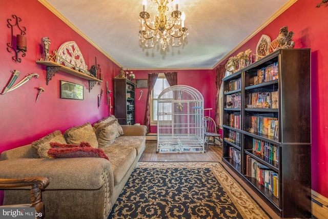 living area with hardwood / wood-style floors, ornamental molding, and a notable chandelier