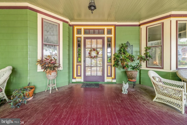 doorway to property featuring covered porch