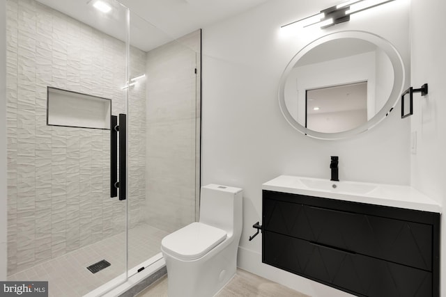 bathroom with vanity, toilet, and walk in shower