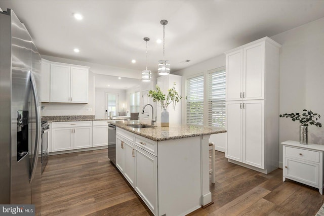 kitchen with white cabinets, sink, and stainless steel appliances