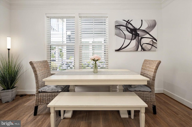 dining space featuring breakfast area and wood-type flooring