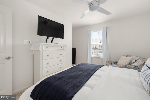 bedroom featuring light colored carpet and ceiling fan