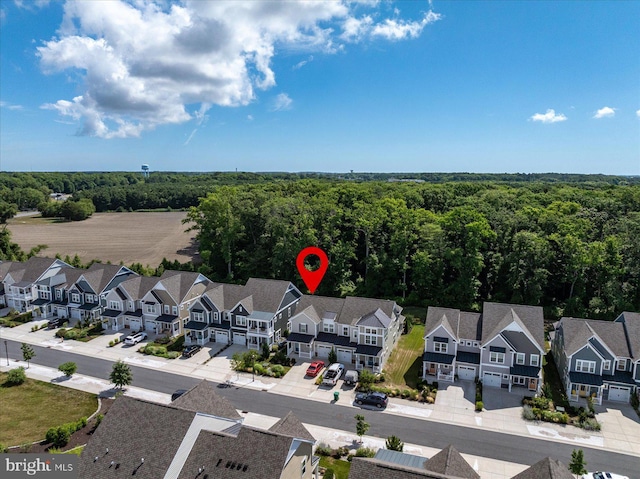 aerial view with a forest view and a residential view