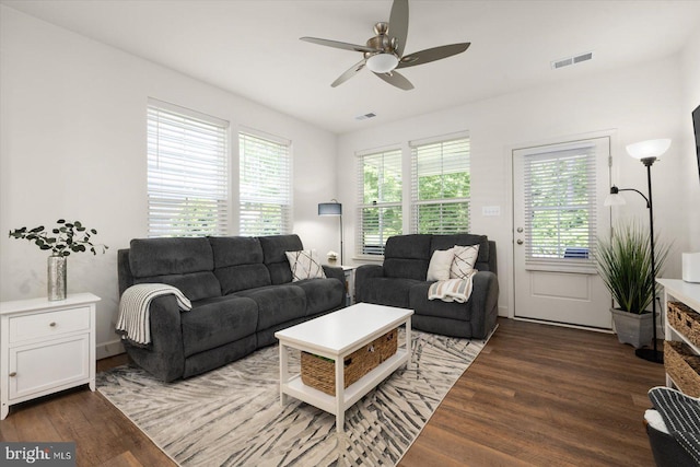 living room with hardwood / wood-style flooring and ceiling fan