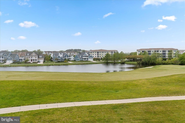 surrounding community featuring a yard and a water view