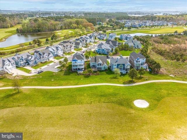 drone / aerial view with a residential view and a water view