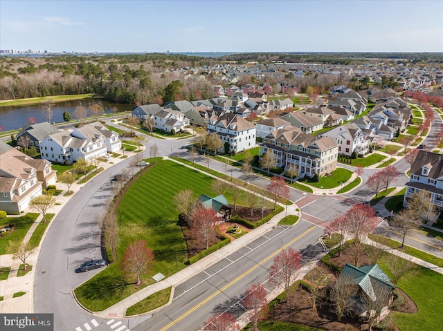 bird's eye view featuring a water view and a residential view