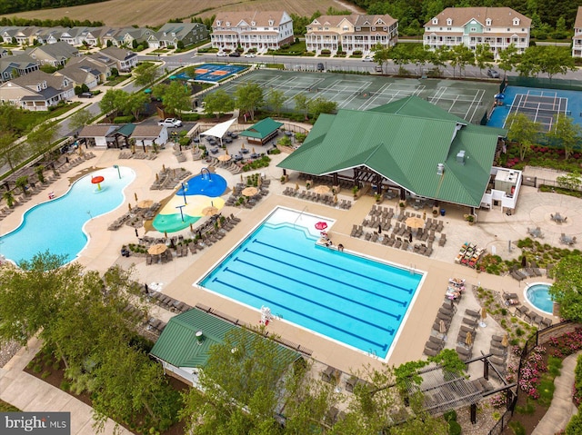 birds eye view of property with a residential view