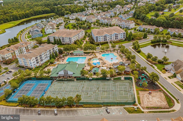 birds eye view of property with a water view