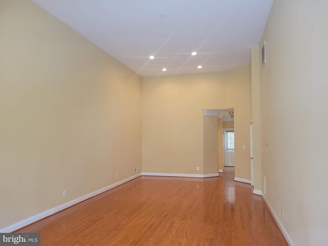 empty room with light hardwood / wood-style flooring