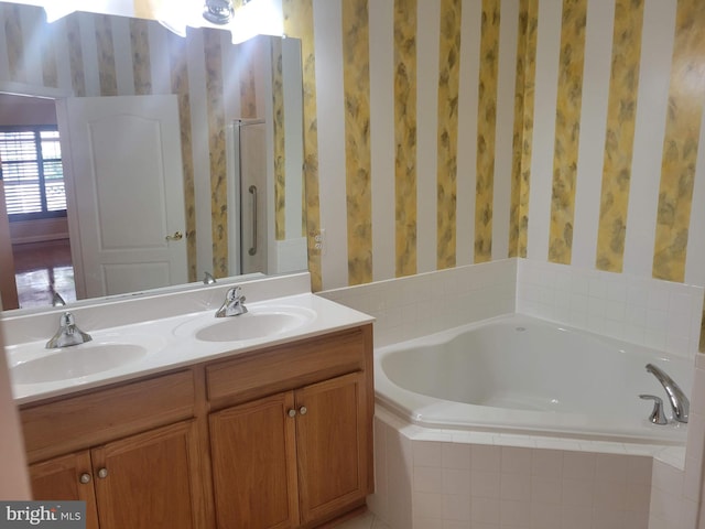 bathroom with vanity and plus walk in shower