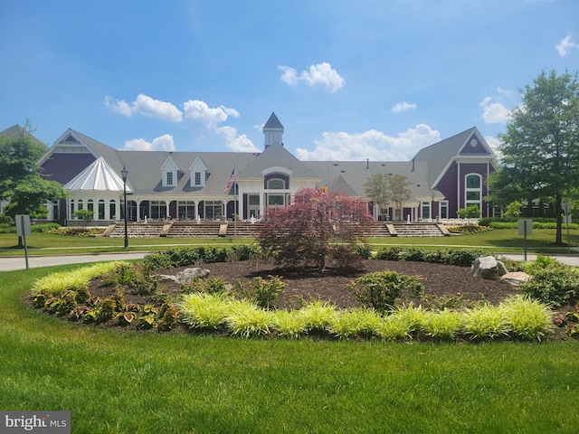 view of property's community with a yard